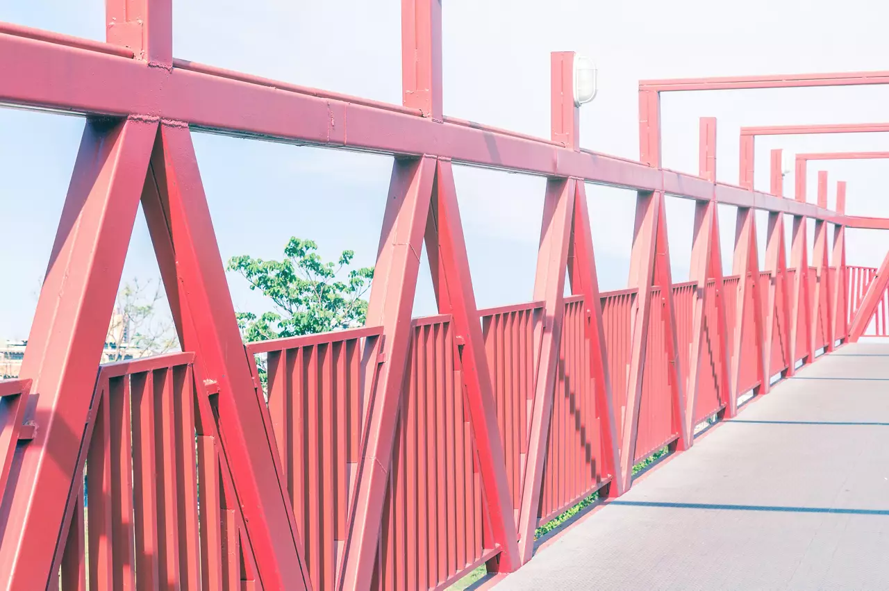 Red bridge with metal structure.